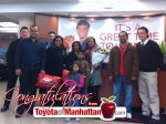Mayuresh and Neetha and their family with Toyota of Manhattan Employees
